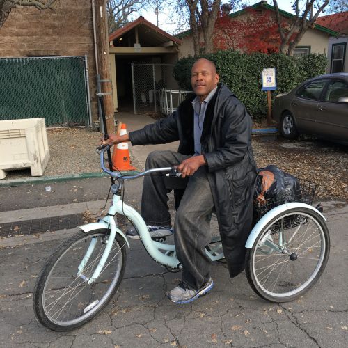 An image of Greg on a tricycle