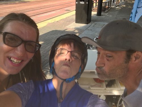 An image of Sister Libby smiling with Holly and Chris
