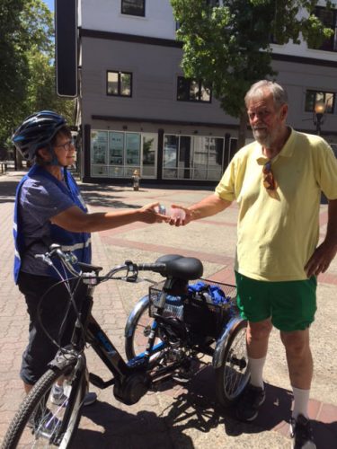 An image of Sister Libby shaking hands with a man
