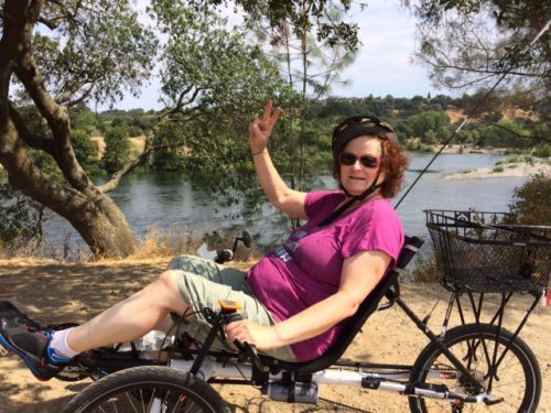 An image of Lynn Whitney on her bike
