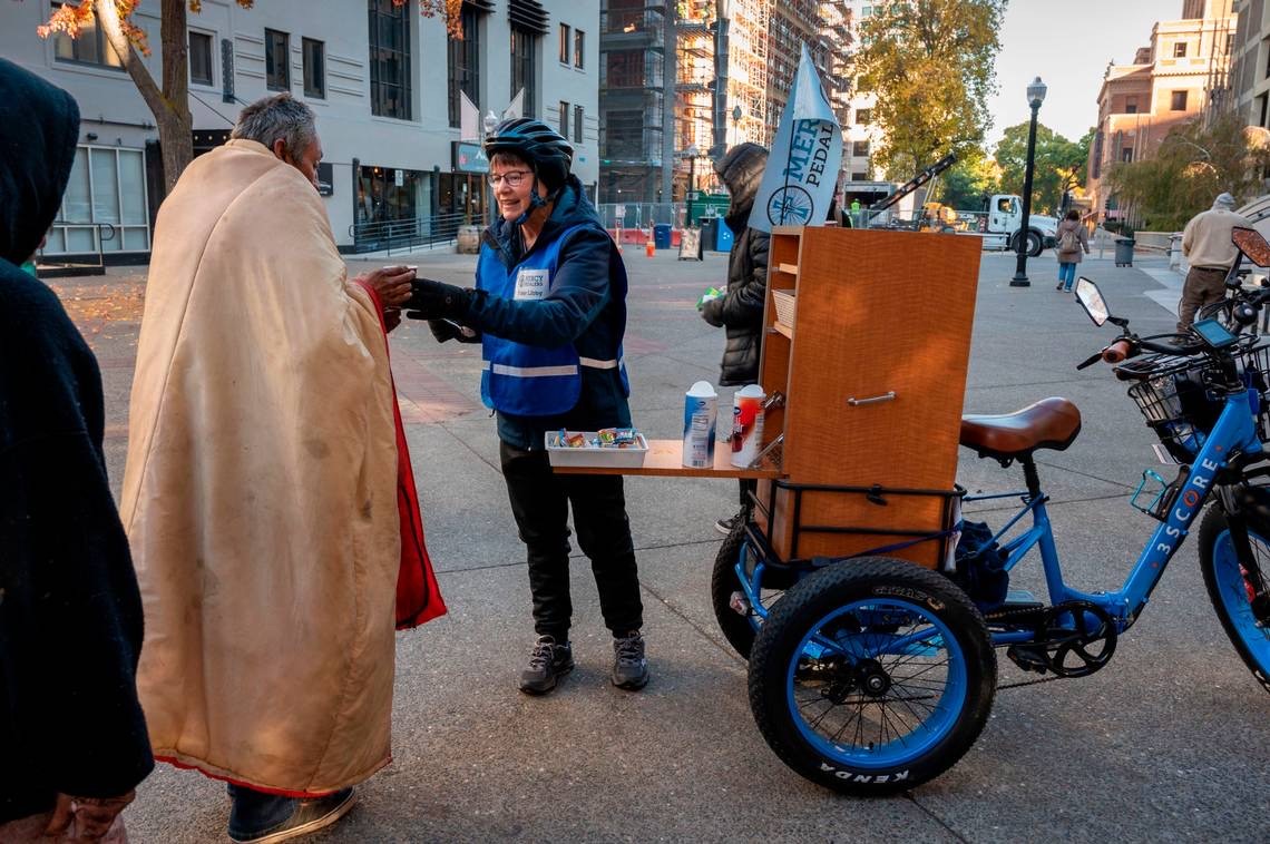 Sister Libby passing out coffee to the homeless